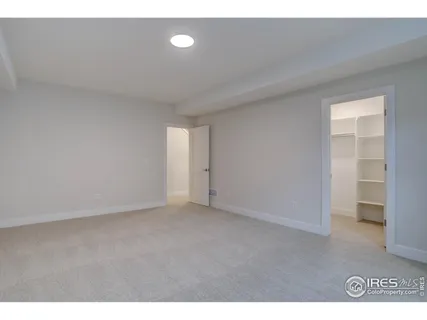 a view of an empty room and a window