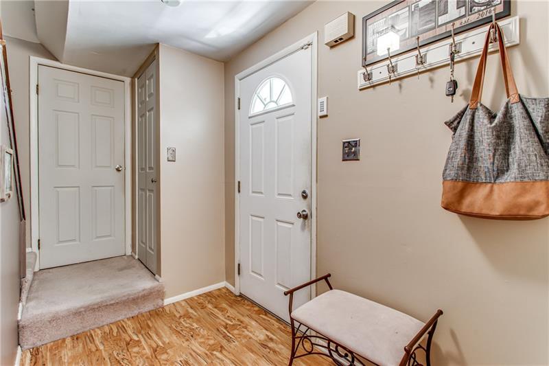 Entry way with coat closet and plenty of space for bags and shoes