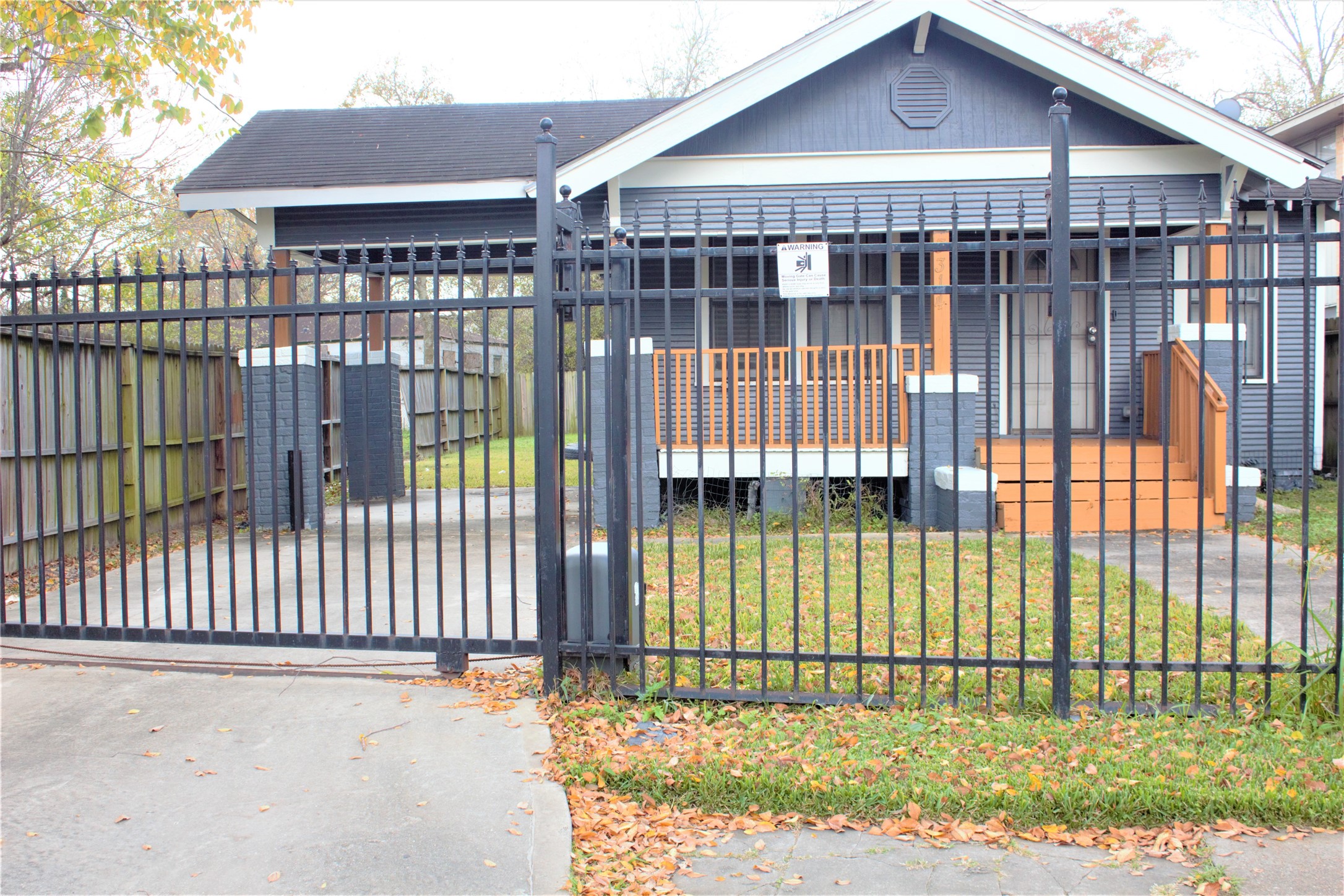 a view of a brick house with a large window