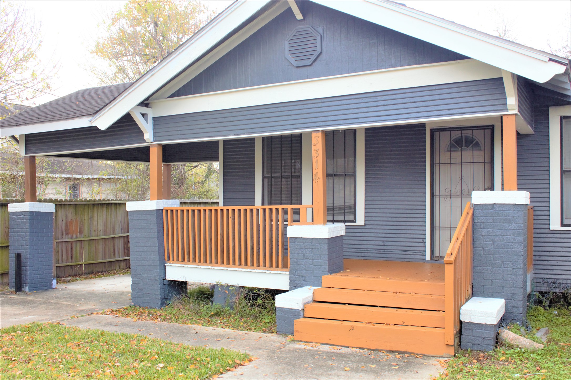 3314 Holman Street Houston, TX 77004 - Photo 3 of 7 a front view of a house with a fence
