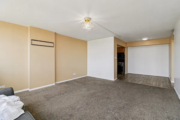 a view of an empty room with a window