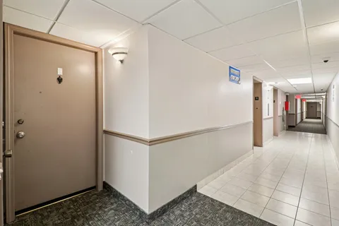 a view of a refrigerator in a kitchen