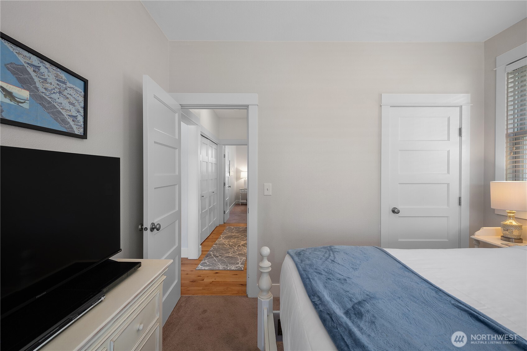 34 Seastar Lane Pacific Beach, WA 98571 - Photo 13 of 28 a bedroom with a bed and a flat screen tv