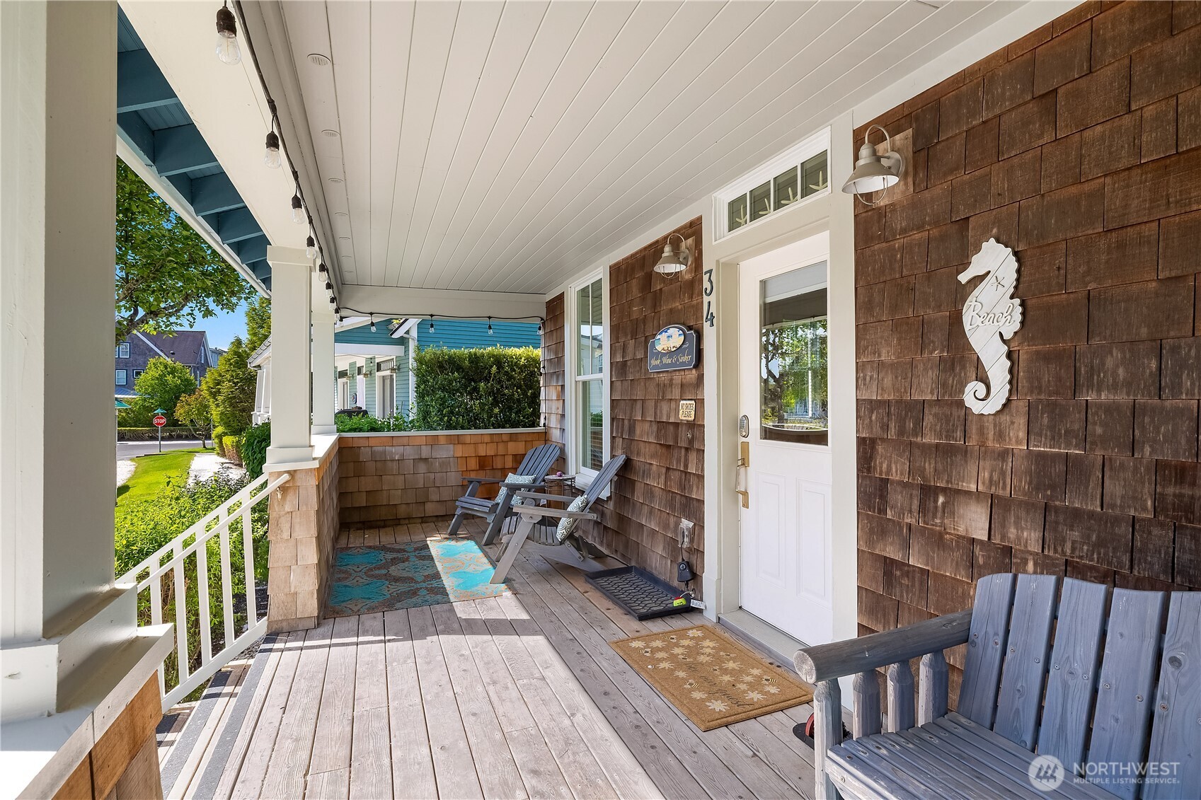 34 Seastar Lane Pacific Beach, WA 98571 - Photo 2 of 28 a balcony with wooden floor table and chairs