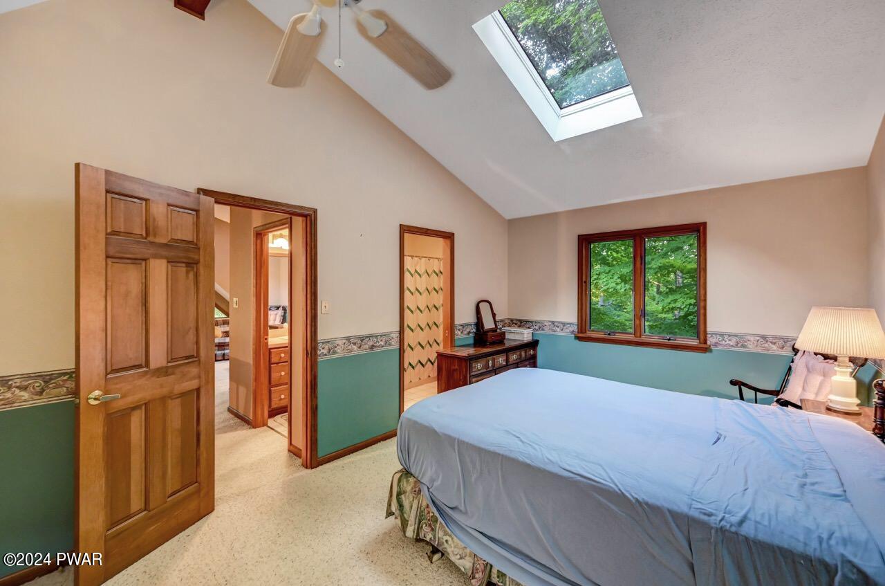 110 Valley Run Road Greentown, PA 18426 - Photo 54 of 67 a bedroom with a bed and large windows