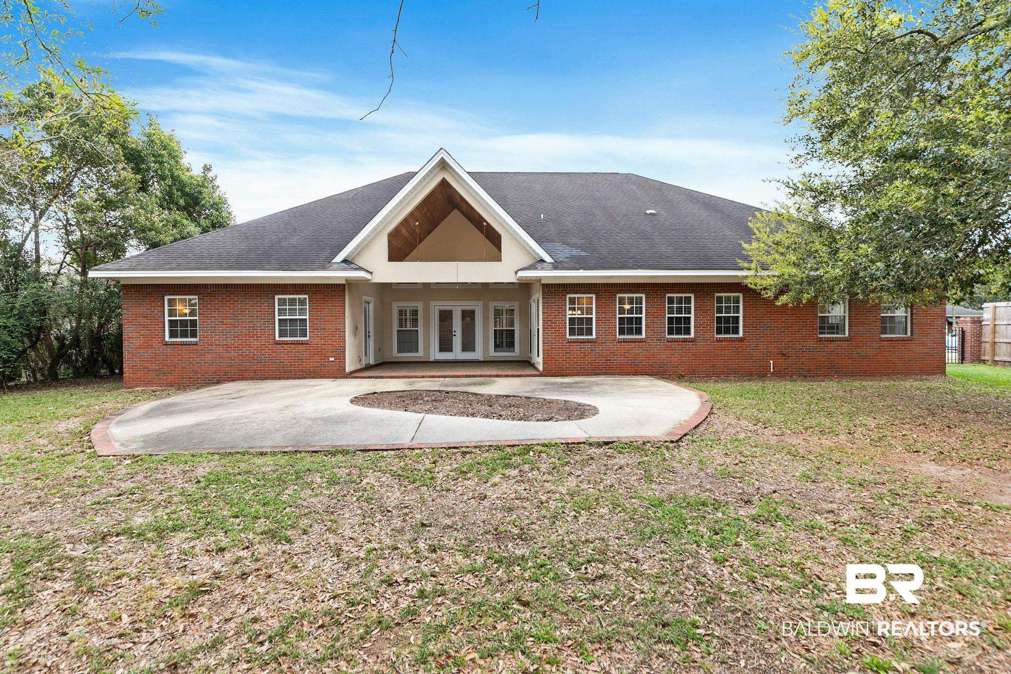3668 Claridge Road North Mobile, AL 36608 - Photo 89 of 100 Back of house with a patio, brick siding, french doors, a yard, and roof with shingles