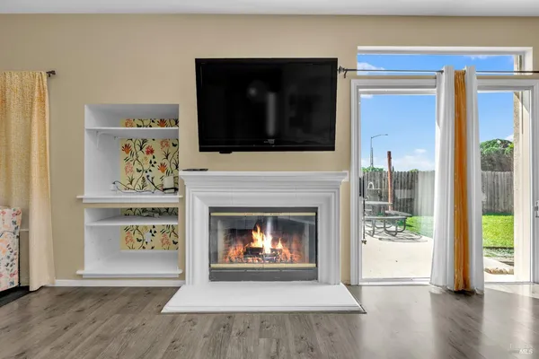a living room with a fireplace and a fireplace