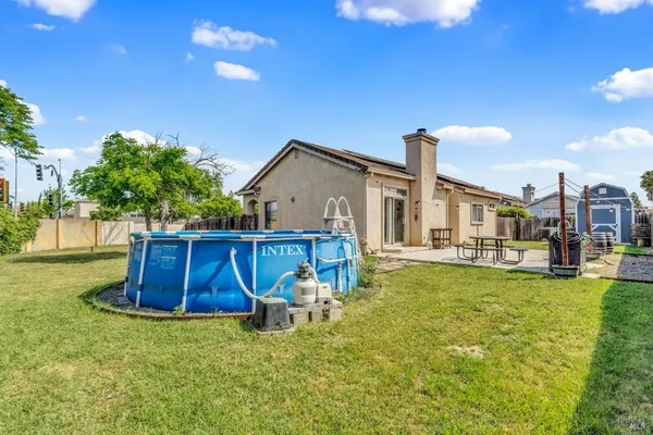 a view of a house with swimming pool