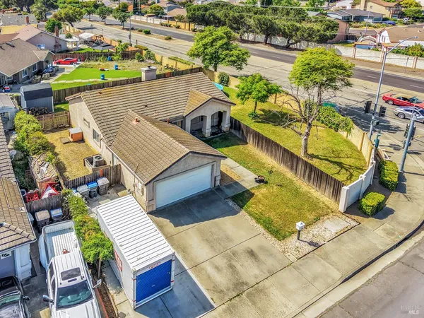 an aerial view of a house with a swimming pool