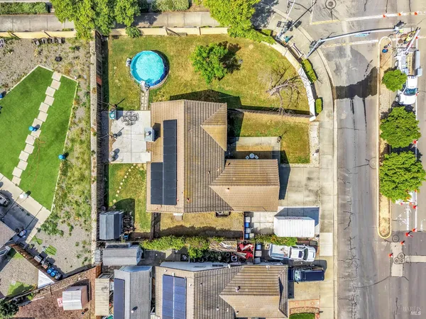a front view of a house with a garden and shower