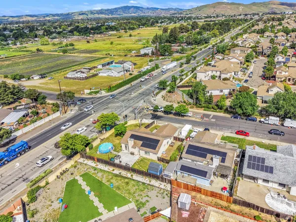 an aerial view of residential houses with outdoor space