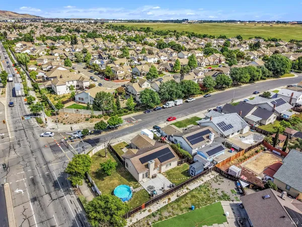 an aerial view of residential houses with outdoor space