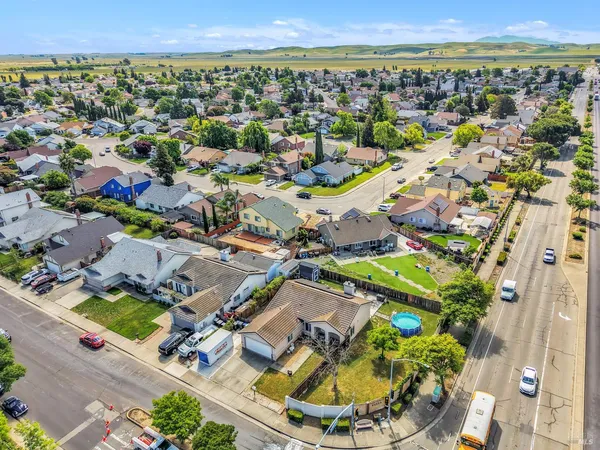 an aerial view of residential houses with outdoor space