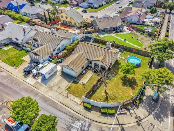 an aerial view of residential houses with outdoor space