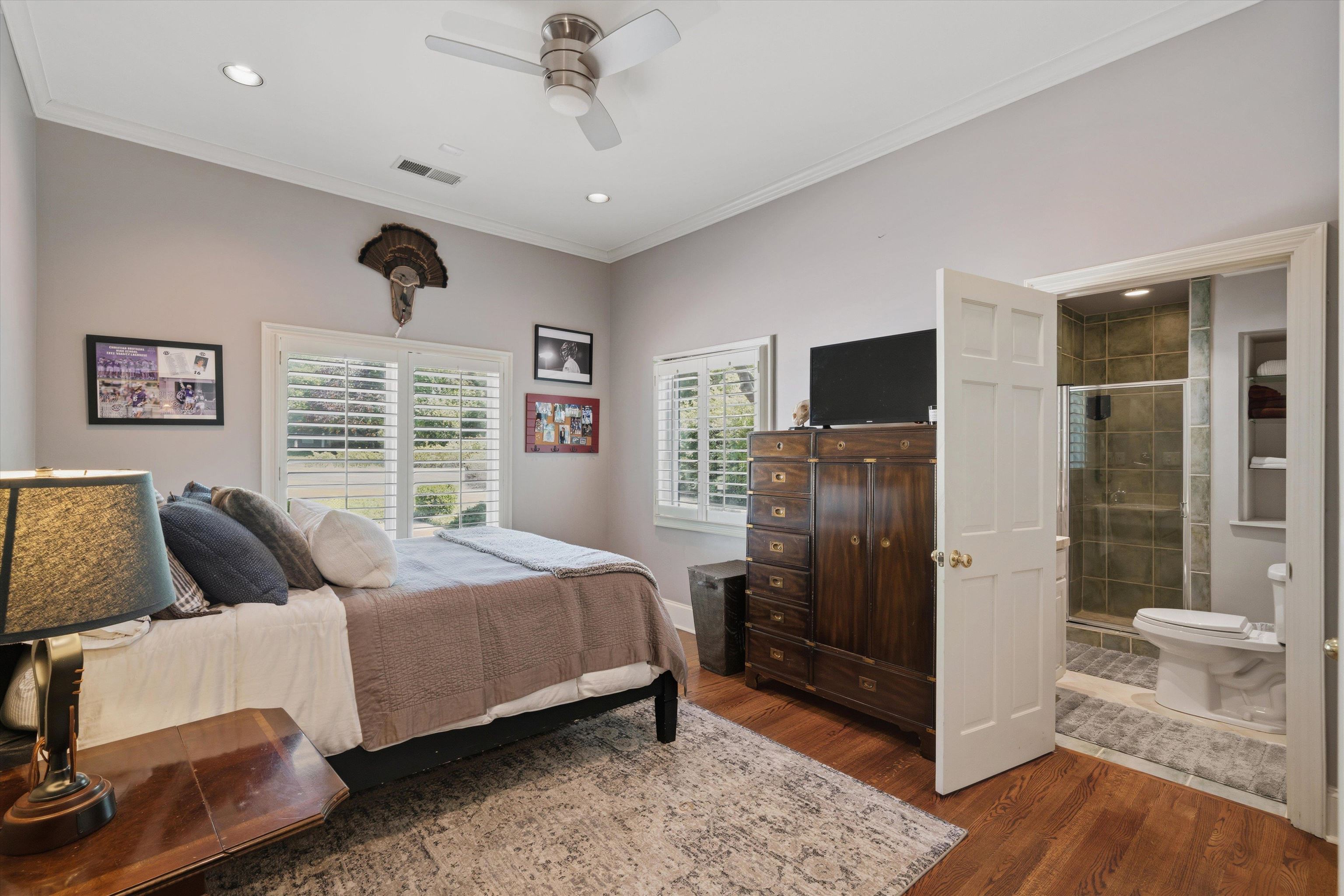 4710 Gwynne Road Memphis, TN 38117 - Photo 23 of 40 a bedroom with a bed and wooden floor