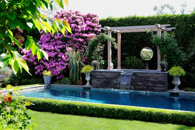 a swimming pool with outdoor seating and yard