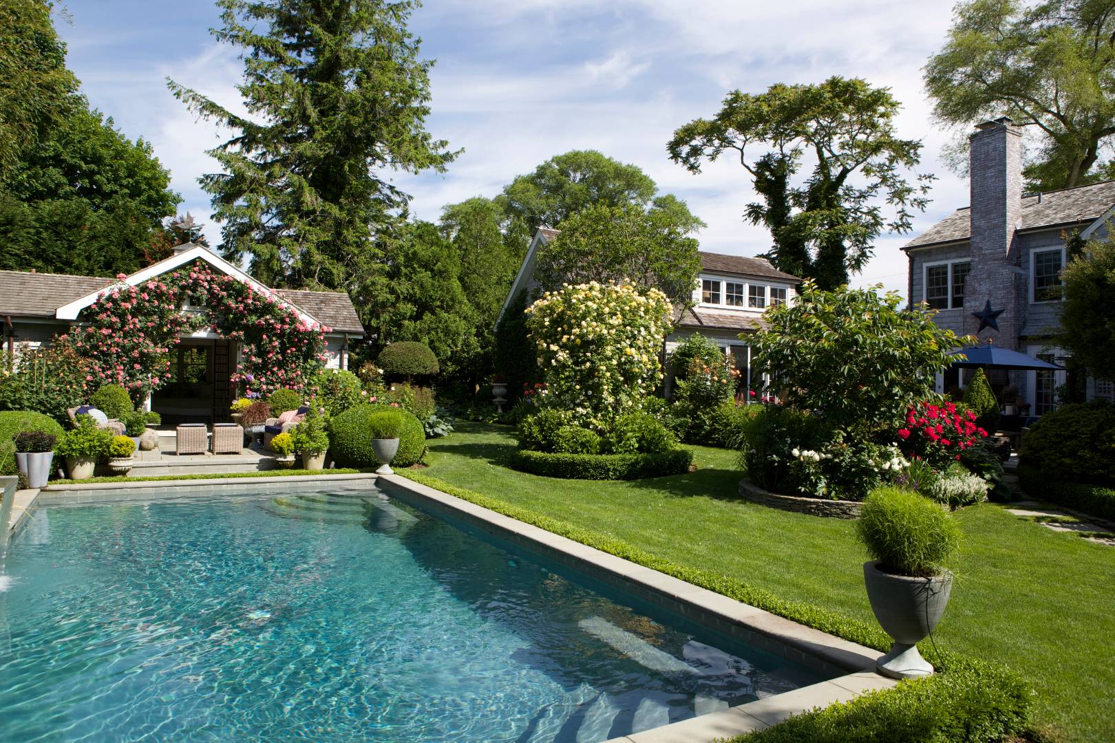 12 Huntington Lane Water Mill, NY 11976 - Photo 2 of 50 a view of a garden with a fountain