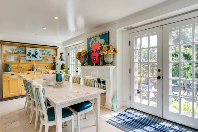 a living room with furniture and next to a window