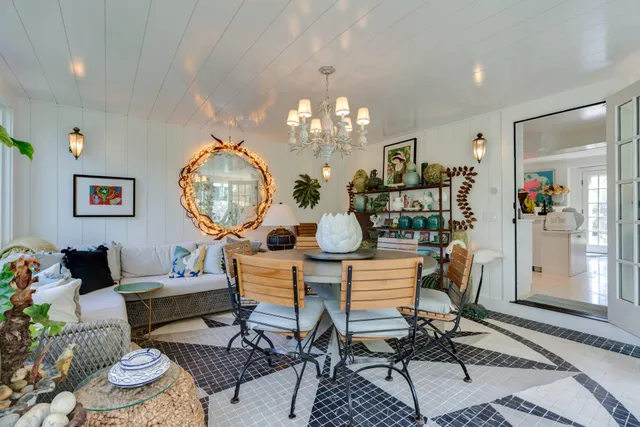 a bedroom with bed and a large window