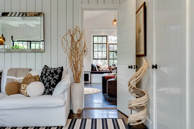 a bedroom with a bed gym equipment and a large window