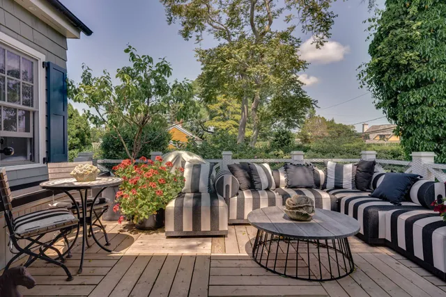 a kitchen with granite countertop a sink and a refrigerator