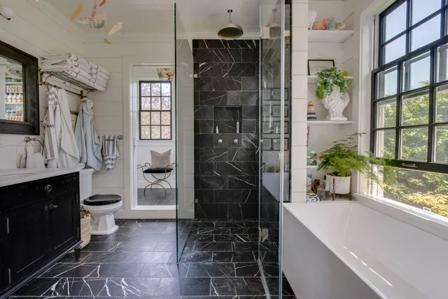 a front view of a house with a yard and fountain