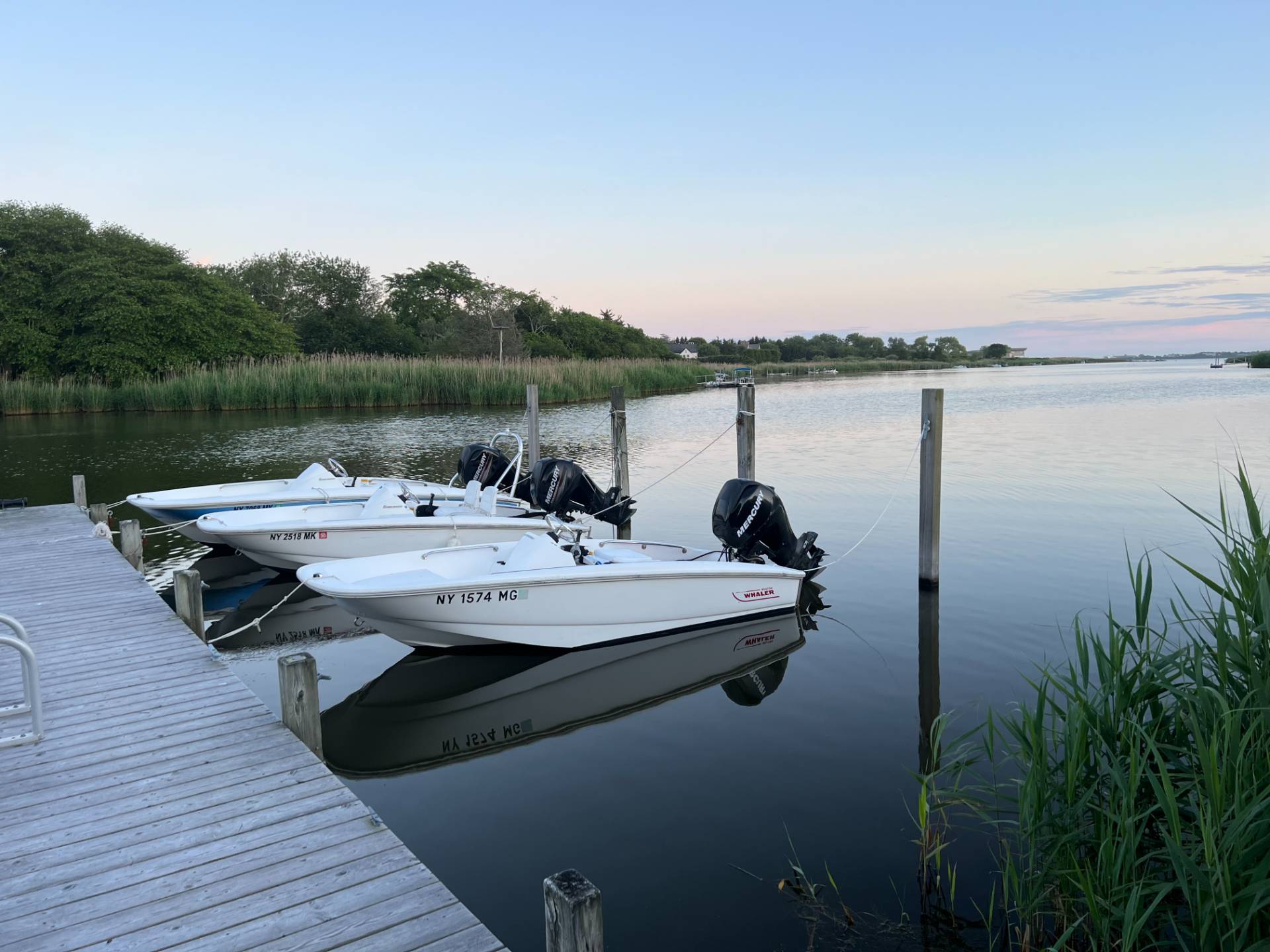 12 Huntington Lane Water Mill, NY 11976 - Photo 50 of 50 a view of a lake with couches chairs and wooden floor