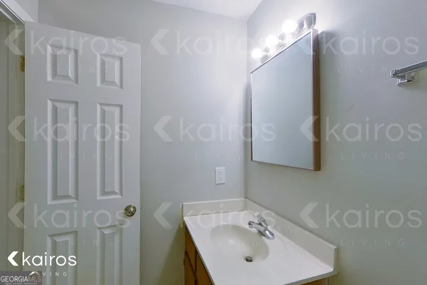 a bathroom with a sink and mirror