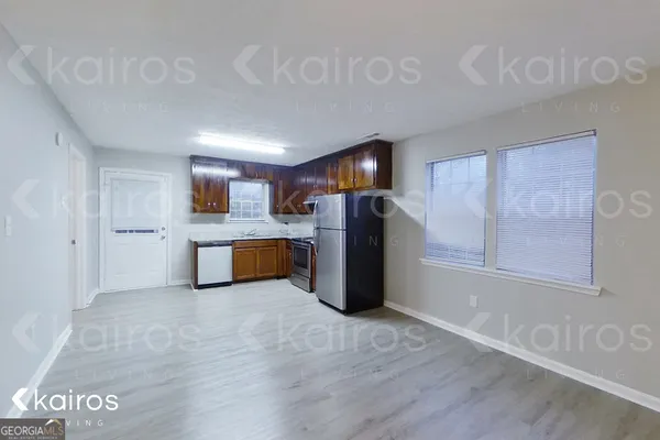 a view of kitchen with furniture and wooden floor