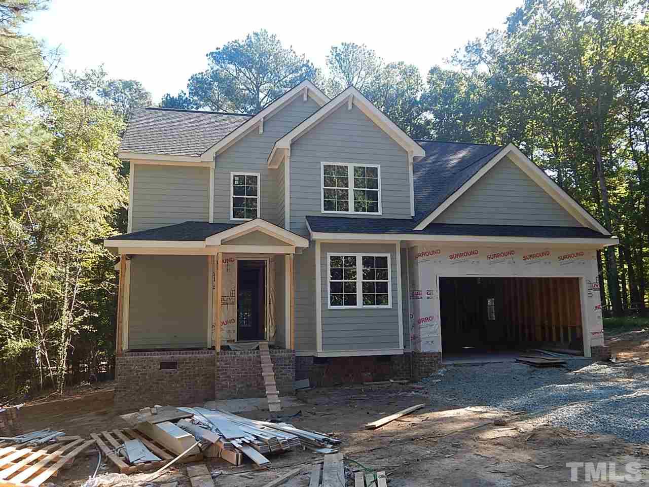 a front view of a house with yard