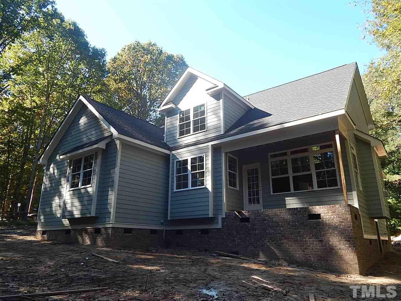 3804 Valley Stream Drive Raleigh, NC 27604 - Photo 3 of 24 a view of a house with a yard