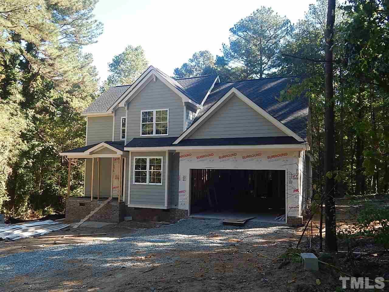3804 Valley Stream Drive Raleigh, NC 27604 - Photo 23 of 24 a front view of a house with a yard