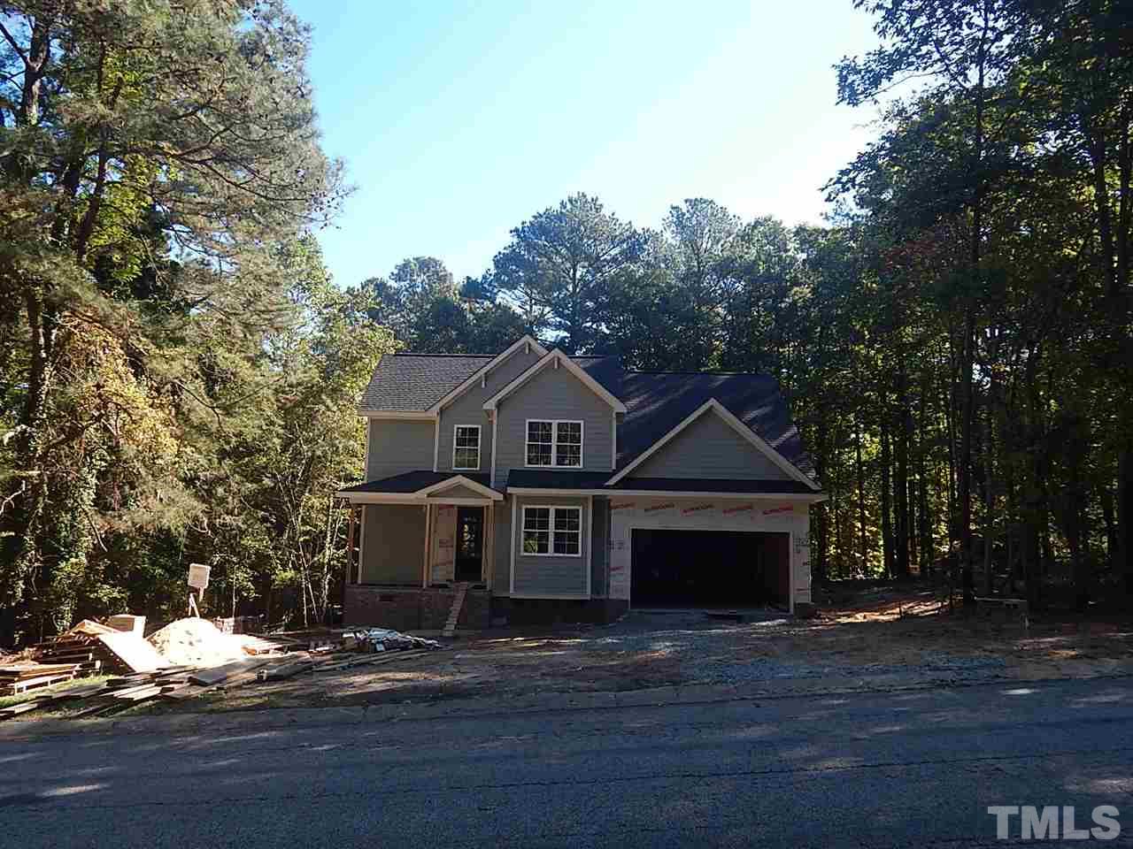 3804 Valley Stream Drive Raleigh, NC 27604 - Photo 4 of 24 a front view of a house with a yard