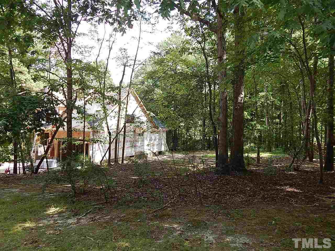 3804 Valley Stream Drive Raleigh, NC 27604 - Photo 7 of 24 a backyard of a house with lots of green space