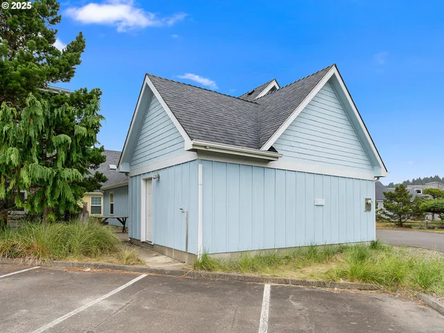 an aerial view of a house with a swimming pool