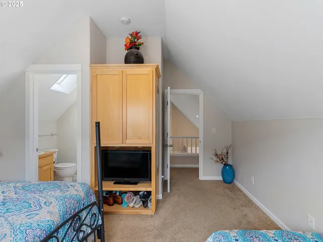 a white toilet sitting next to a bathroom sink