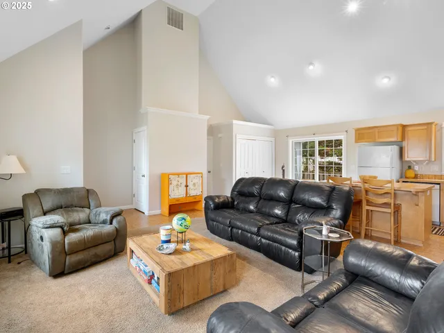a dining room with a table and chairs