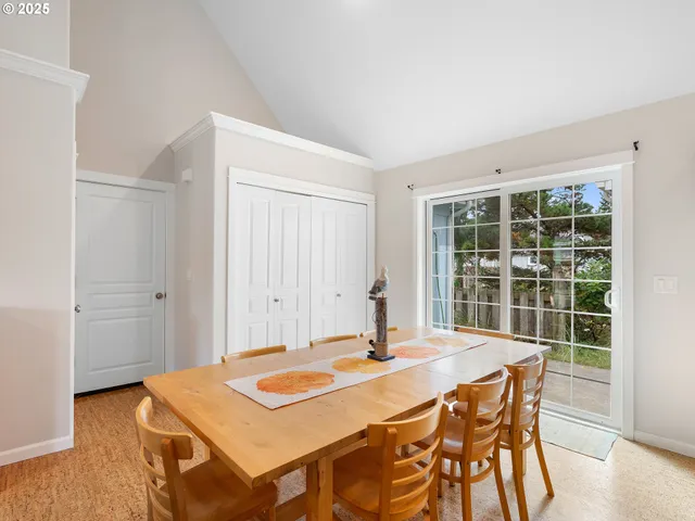 a large kitchen with a table and chairs