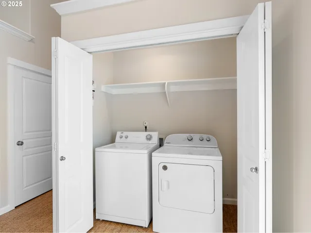 a kitchen with a table chairs refrigerator and cabinets