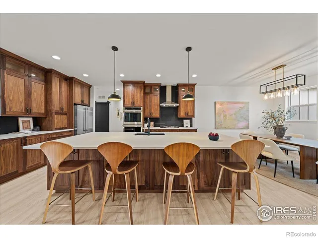 a dinning table and chairs in a kitchen
