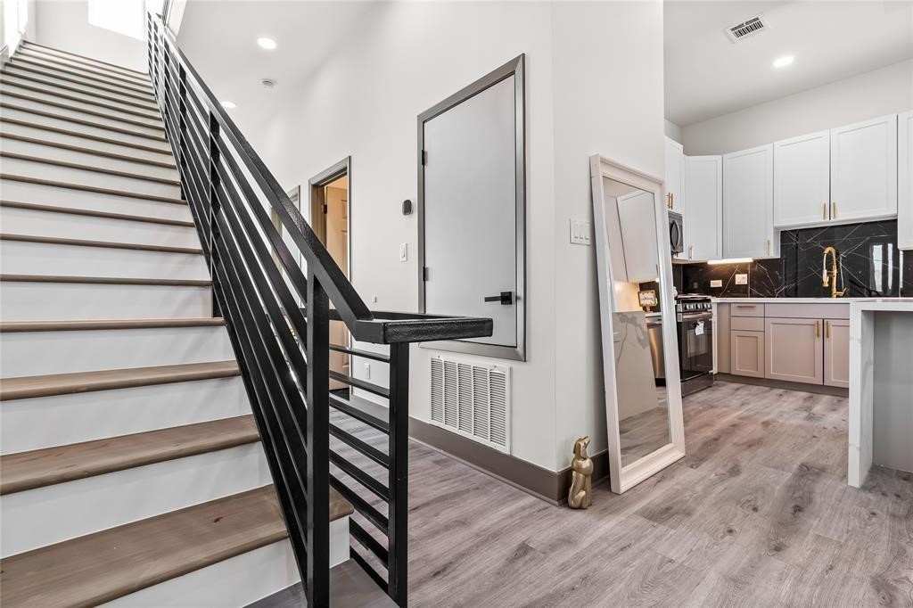 3620 Lehall Street Houston, TX 77021 - Photo 18 of 32 a view of a kitchen with wooden floor and electronic appliances