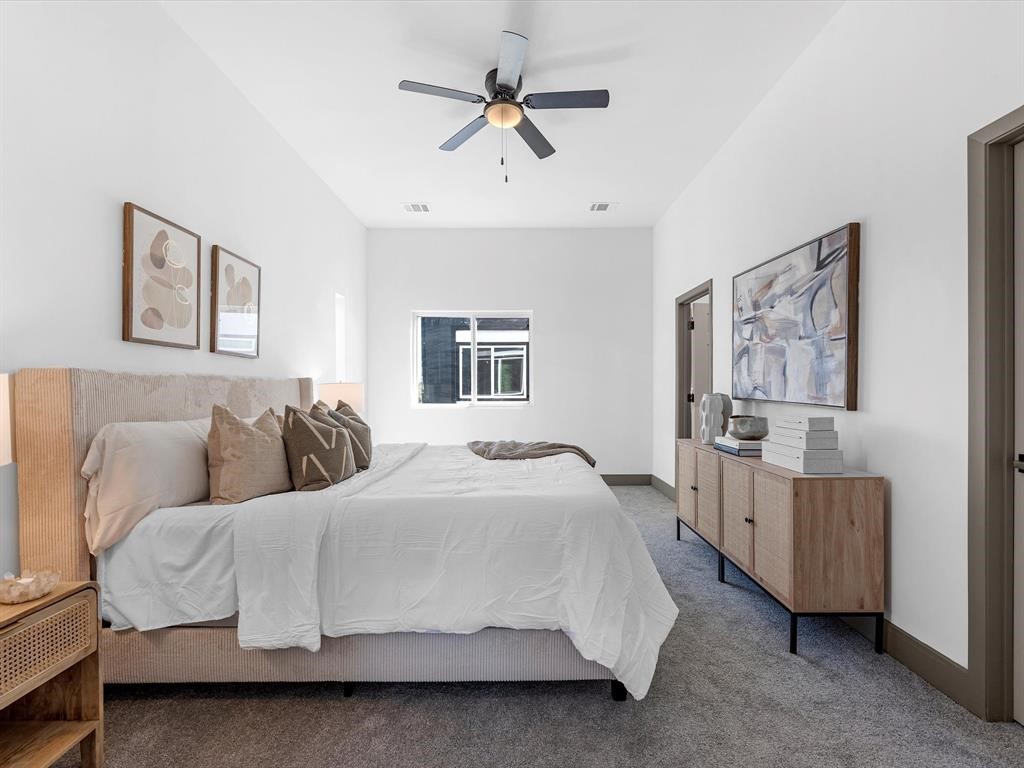 3620 Lehall Street Houston, TX 77021 - Photo 20 of 32 a bedroom with a bed and a chandelier