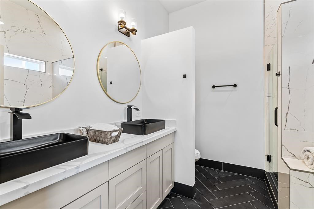 3620 Lehall Street Houston, TX 77021 - Photo 23 of 32 a bathroom with a sink and a mirror