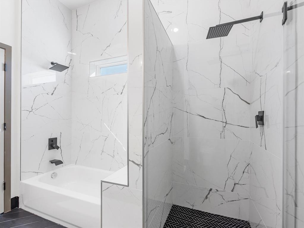 3620 Lehall Street Houston, TX 77021 - Photo 25 of 32 a bathroom with a bathtub and a shower