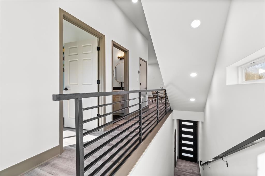 3620 Lehall Street Houston, TX 77021 - Photo 8 of 32 a view of a hallway with wooden floor and staircase