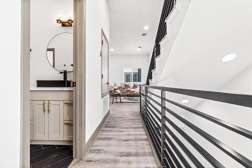 3620 Lehall Street Houston, TX 77021 - Photo 10 of 32 a view of a hallway with wooden floor and staircase
