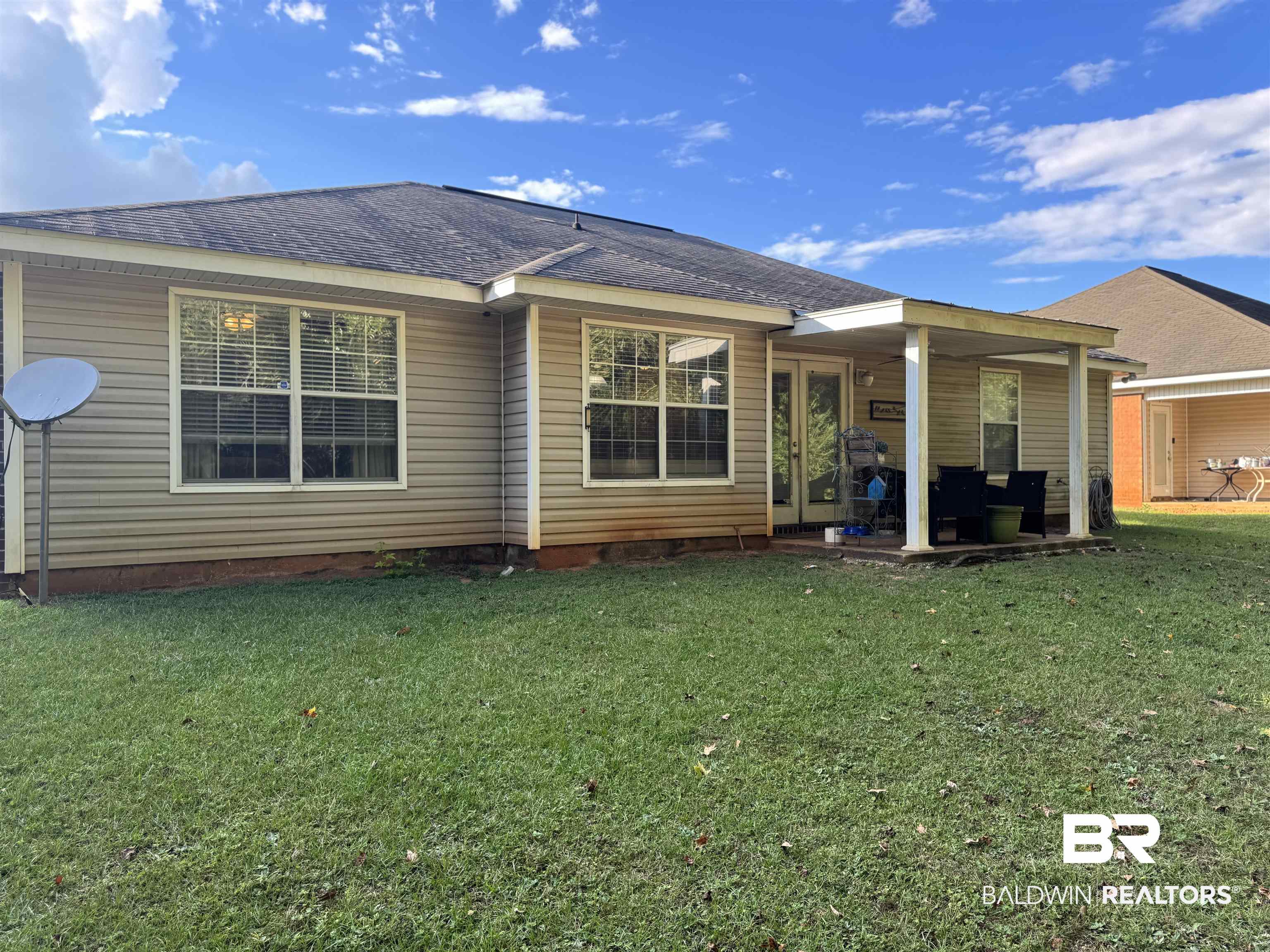 2245 Spring Grove North Mobile, AL 36695 - Photo 10 of 10 Back of house with roof with shingles, a yard, a patio, and french doors