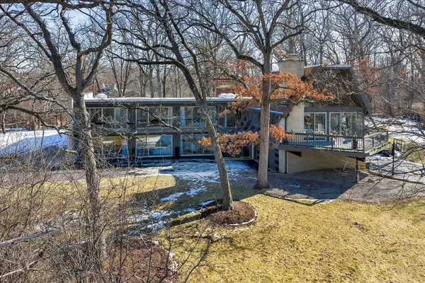 a view of a house with snow on the background