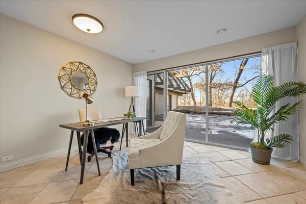 a view of a couches and table in the balcony