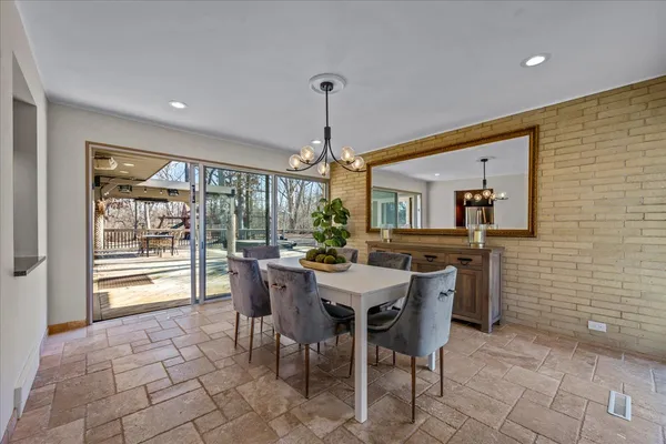 a dining room with furniture and window